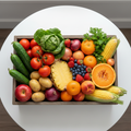 A beautiful box overflowing with fresh seasonal fruits and vegetables
